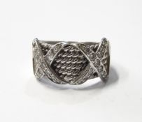 White gold (probably 18ct) and diamond dress ring with multiple bands of rope design with two