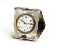 Engine-turned silver cased travelling clock,