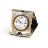 Engine-turned silver cased travelling clock,