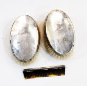 Pair of silver backed brushes and a silver mounted comb,