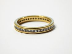 Yellow gold and princess diamond full eternity ring,