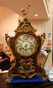 French rococo style boulle and ormolu mounted mantel clock having cherub holding boat hook astride