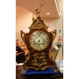 French rococo style boulle and ormolu mounted mantel clock having cherub holding boat hook astride