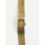 Lady's 9ct gold Omega bracelet watch with square dial,