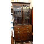 Georgian secretaire bookcase with stepped and dentil cornice, astragal-glazed panel doors,