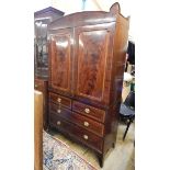 Georgian mahogany inlaid linen press with broken-arch shaped pediment, stringing and floral inlay,