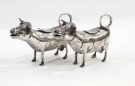 Pair of French silver cow creamers 800 standard,