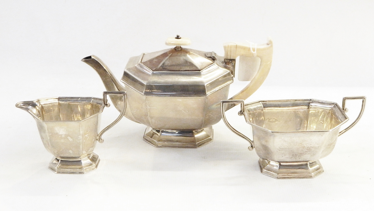 Silver three-piece teaset by Viners Limited, Sheffield 1939 of octagonal panelled form,