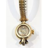 Lady's gold Ulysse Nardin bracelet watch, the case marked 14K,