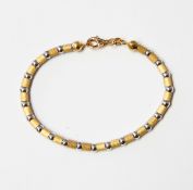 18ct gold bracelet with alternating textured yellow gold cylindrical beads and white gold beads