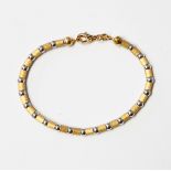 18ct gold bracelet with alternating textured yellow gold cylindrical beads and white gold beads