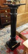 Victorian ebonised jardiniere stand with reeded column, on square plinth,