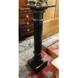 Victorian ebonised jardiniere stand with reeded column, on square plinth,