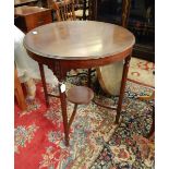 Mahogany circular occasional table on fluted legs with circular undershelf,