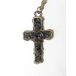 Silver-coloured cross pendant set with amethyst and other quartz,