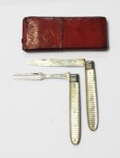 Georgian silver folding fruit knife and fork set with banded mother-of-pearl handles,