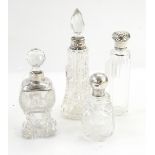 Three cut glass dressing table bottles with silver mounts and one other