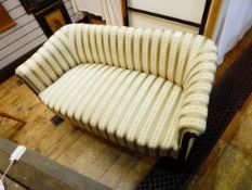 Edwardian two-seat sofa upholstered in a Regency-style striped fabric and having patterae and line