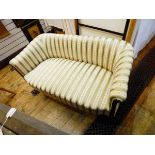 Edwardian two-seat sofa upholstered in a Regency-style striped fabric and having patterae and line