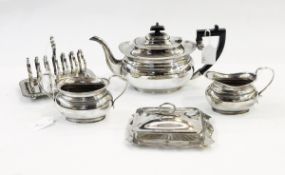 Quantity of assorted silver plate including a three-piece teaset, toast racks,