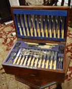 Canteen of silver plated flatware of stylised dog nose design, comprising 12 table knives and forks,