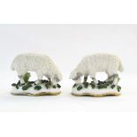 Pair of Staffordshire china chip-coated model sheep and Solomanware bonbon dish with cream ground