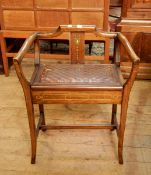 Mahogany piano stool with inlaid and painted splat to the shaped back and arms, leather seat,