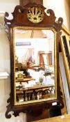 Chippendale style mahogany and parcel gilt wall mirror having fret carved surround,