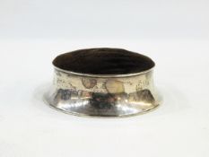 George V silver hat pin stand of circular form with spreading foot, velvet covered top,