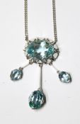 18ct white gold and aquamarine necklace, the pendant with central oval mixed cut aquamarine,