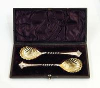 Set of six silver teaspoons and matching tongs having pierced handles and scrollwork finials,