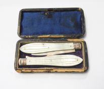 Victorian silver folding fruit knife and fork set with fluted mother-of-pearl handles,