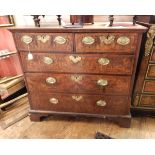 18th century figured walnut chest of two short and three long graduated drawers, ogee mould top,