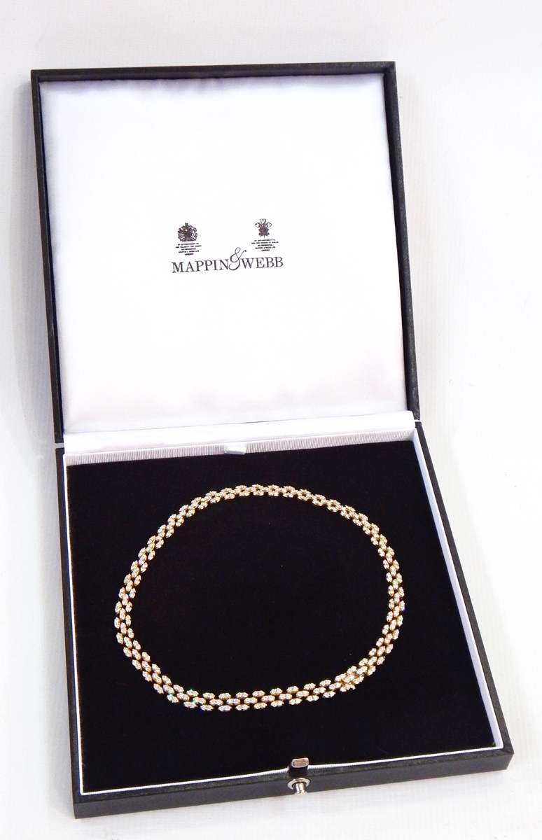 18ct gold and diamond collar necklace, having three interlinked rows of almond-shaped links,