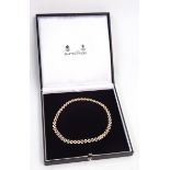 18ct gold and diamond collar necklace, having three interlinked rows of almond-shaped links,