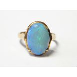 Gold and opal ring, the oval opal cabochon in four-claw setting,