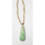 Carved jade pendant together with a 9ct gold neck chain