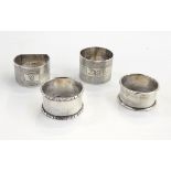 Four assorted silver napkin rings