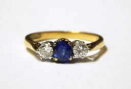 18ct gold, sapphire and diamond three-stone ring,