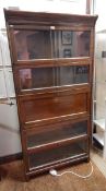 Five-section oak Wernicke bookcase, the centre section as a secretaire,