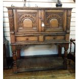 Jacobean style reproduction oak side cabinet with carved panels,