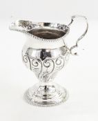 Late Victorian silver cream jug by Henry Stratford, London 1898, the body decorated with scrolls,