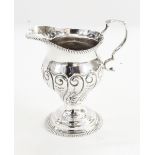 Late Victorian silver cream jug by Henry Stratford, London 1898, the body decorated with scrolls,