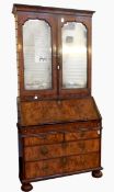 Queen Anne figured walnut bureau bookcase with cavetto pediment, mirrored panel doors,