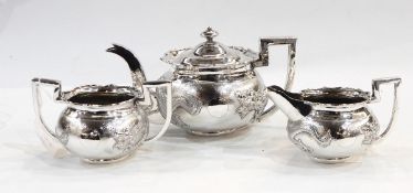 Chinese silver three-piece teaset comprising teapot, two-handled sugar bowl and milk jug,