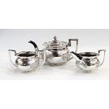 Chinese silver three-piece teaset comprising teapot, two-handled sugar bowl and milk jug,