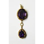 18ct gold and amethyst pendant the oval mixed cut amethyst with pear-shaped amethyst drop beneath,