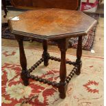 Oak octagonal occasional table with baluster-shaped supports and bobbin turned stretchers,