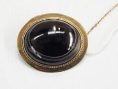 Gold and agate brooch, the oval banded agate cabochon set in a gold mount with ropetwist decoration,