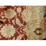 Afghan Ziegler-style rug hand-woven in Pakistan with cream and red ground,